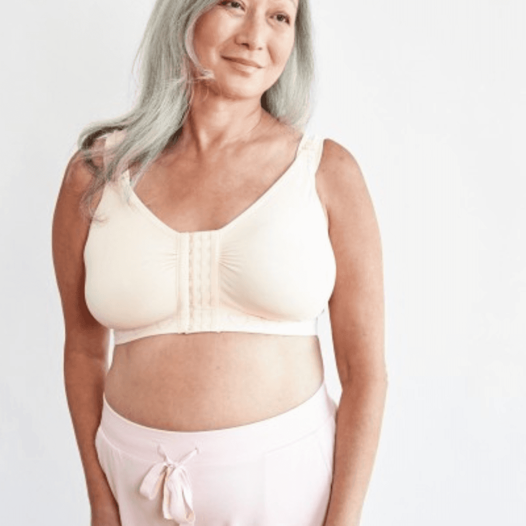Cancer Research UK Post-Surgery Comfort Bra - Soft bamboo fabric bra designed for breast cancer patients. Offers comfort and support after mastectomy or breast cancer surgery. Available in white, black, and blush. Sizes range from Small to XXL. 100% net profits fund breast cancer research.