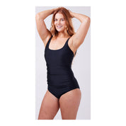 side image of woman wearing the black ostomy swimsuit by cancer research uk