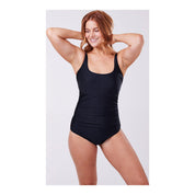 A model is wearing a solid black one-piece swimsuit with adjustable straps, designed to accommodate an ostomy bag.by cancer research uk