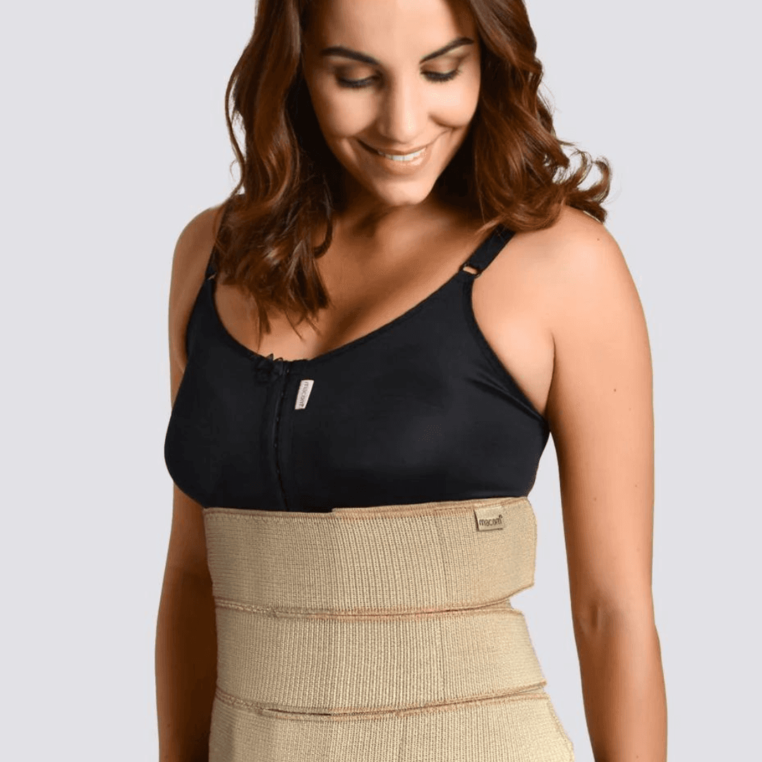 Image of a Macom 3 Panel Binder in clay for abdominal surgery recovery. An abdominal binder with velcro fastening provides flexible and adjustable compression. Ideal for post-abdominal surgery recovery including hernia surgery, bariatric surgery, and as a back support. Enhance your recovery with this comfortable and supportive compression garment.