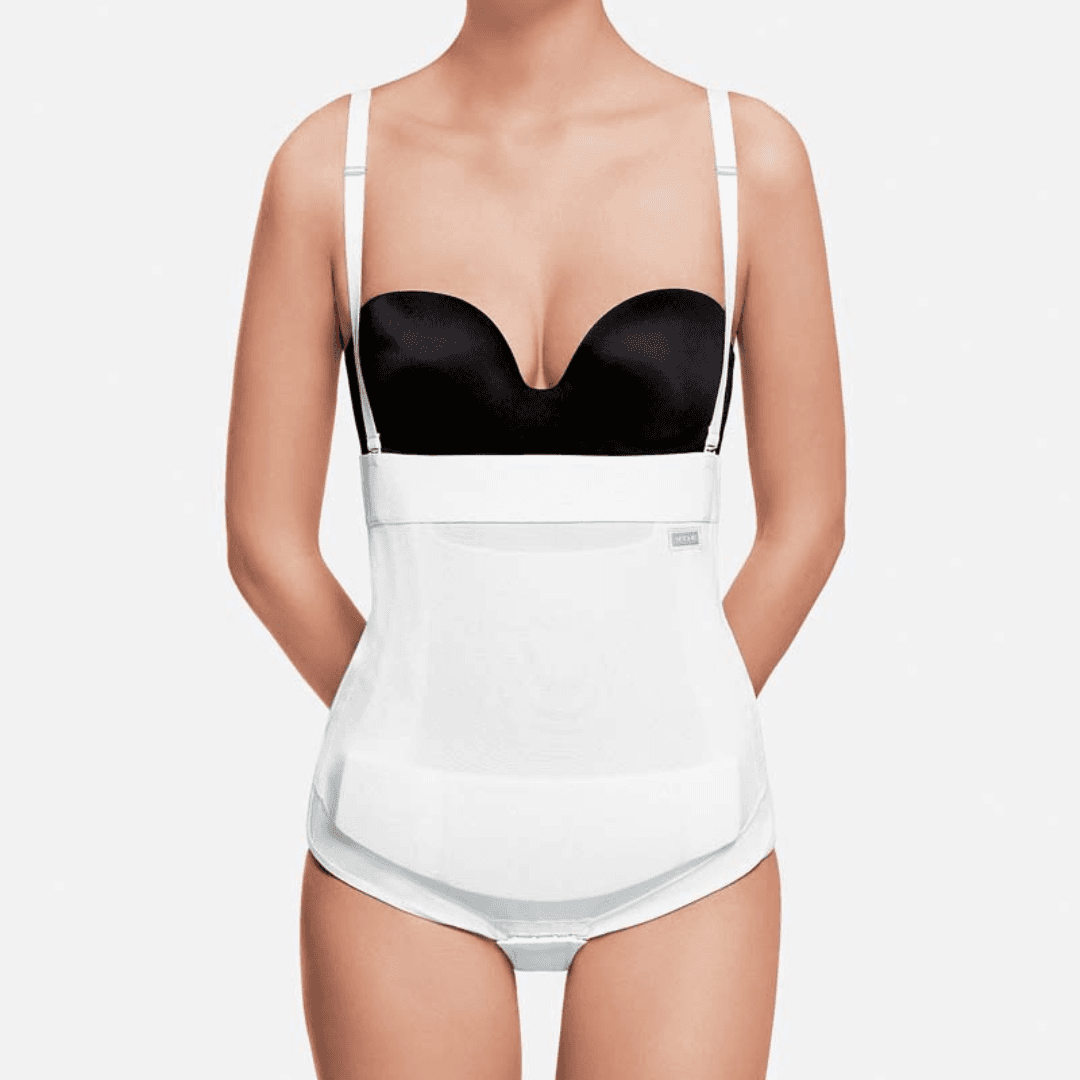 Image of Recova tummy tuck female supporter with adjustable Velcro side openings. This post surgery compression garment provides optimal compression through double skin reinforcements. It includes a unique pocket with a removable foam insert for targeted scar area compression. With detachable and adjustable shoulder straps, flat seams, and compatibility with EPI-FOAM Pads, it is ideal for abdominoplasty, pubic procedures, C-sections, or abdominal liposuction