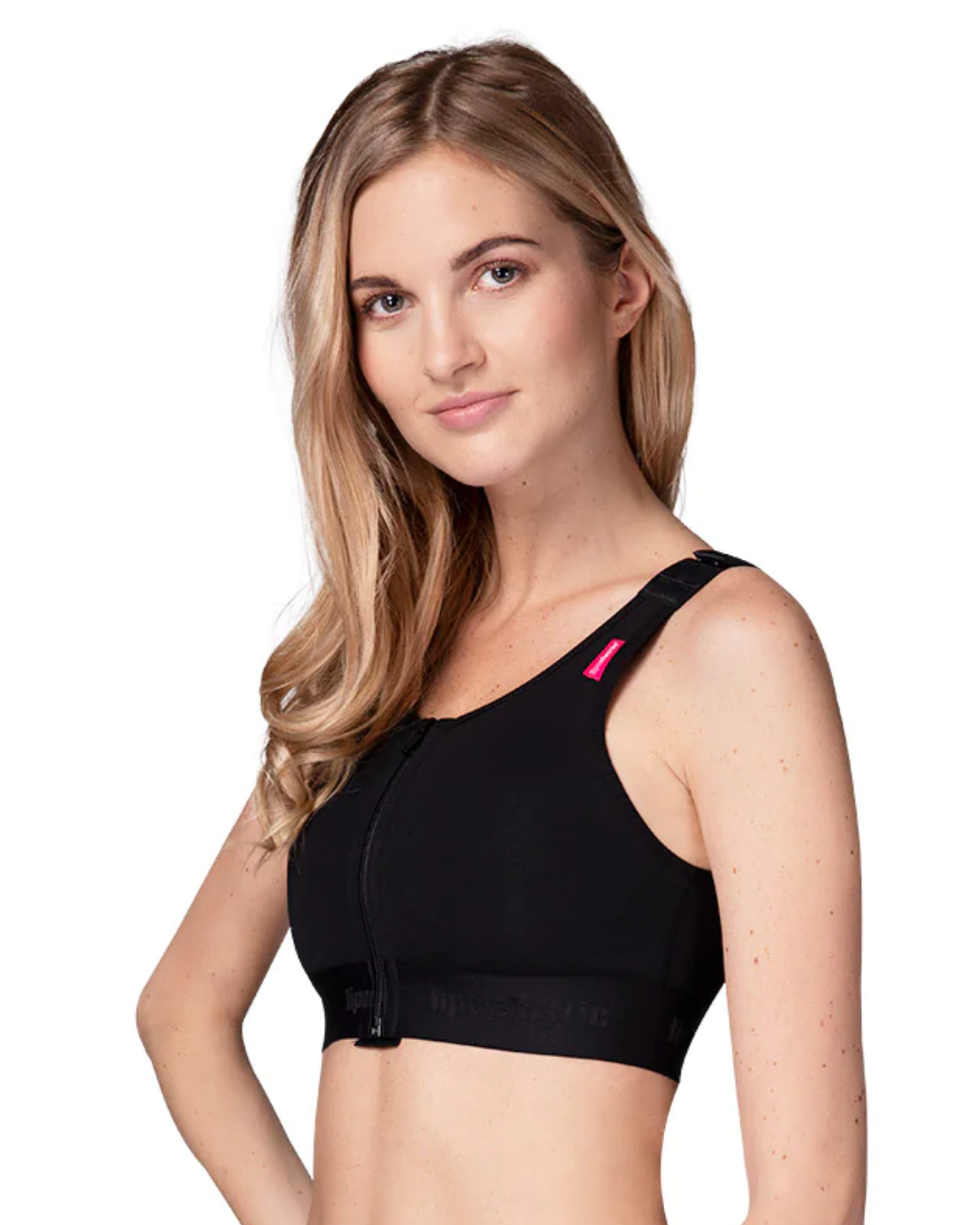 Woman wearing a black bra, lipoelastic pi unique for breast surgery