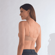 The Amoena Barbara is a strapless post-surgery bra with bi-lateral pockets for breast forms or prostheses. It offers versatile styling with multi-way straps and molded padded cups for a smooth silhouette and underwire support.