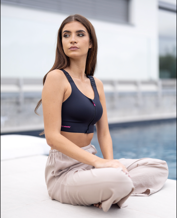 Woman wearing the lipoelastic pi elite post surgery bra 