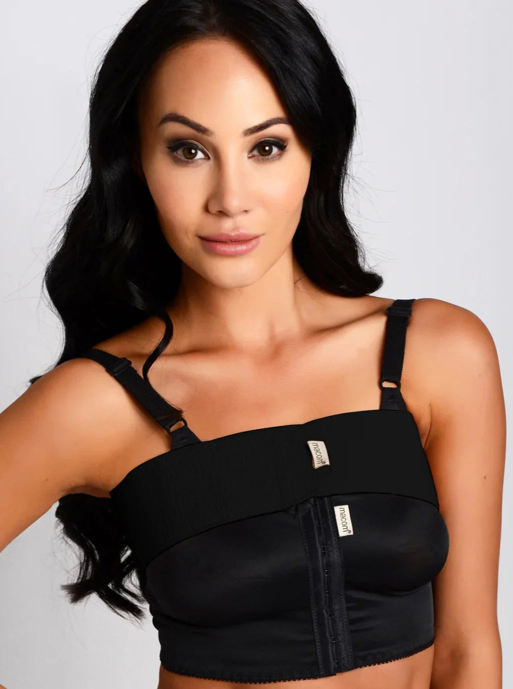 woman wearing the macom post op breast stabliser band