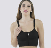 Woman wearing the black macom second stage bra, suitable 6 weeks post surgery 