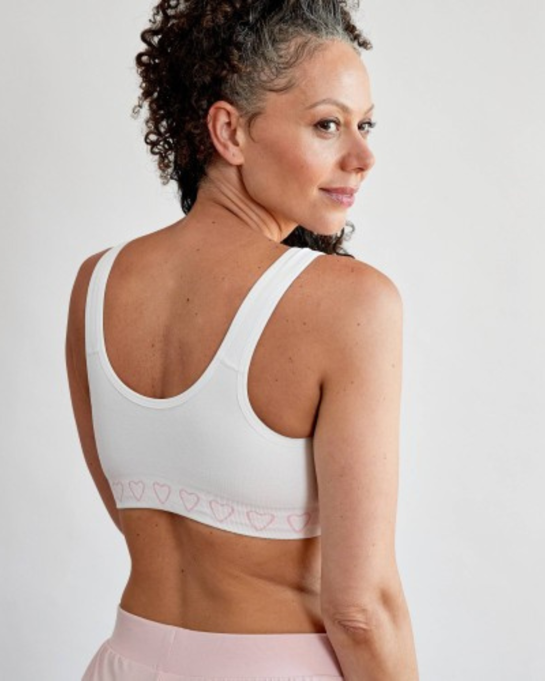 Cancer Research UK Post-Surgery Comfort Bra - Soft bamboo fabric bra designed for breast cancer patients. Offers comfort and support after mastectomy or breast cancer surgery. Available in white, black, and blush. Sizes range from Small to XXL. 100% net profits fund breast cancer research.