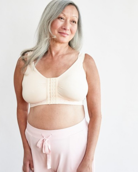 Discover the Cancer Research UK Post-Surgery Comfort Bra, designed for breast cancer patients. Made from soft, breathable bamboo fabric, this bra offers comfort and support after mastectomy or breast cancer surgery. Available in multiple colours and sizes. 100% net profits fund breast cancer research