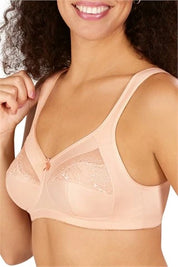 A woman wearing a pink Amoena Isadora mastectomy bra with seamlessly integrated pockets.