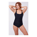 A model is wearing a solid black one-piece swimsuit with adjustable straps, designed to accommodate an ostomy bag.by cancer research uk