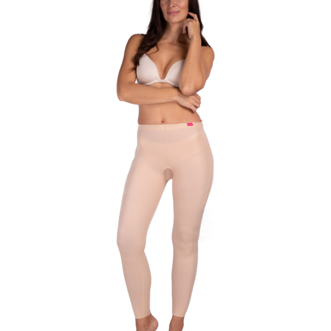Woman wearing Lipoelastic TB Comfort leggings post-surgery compression garment designed to support recovery after liposuction or body contouring procedures.