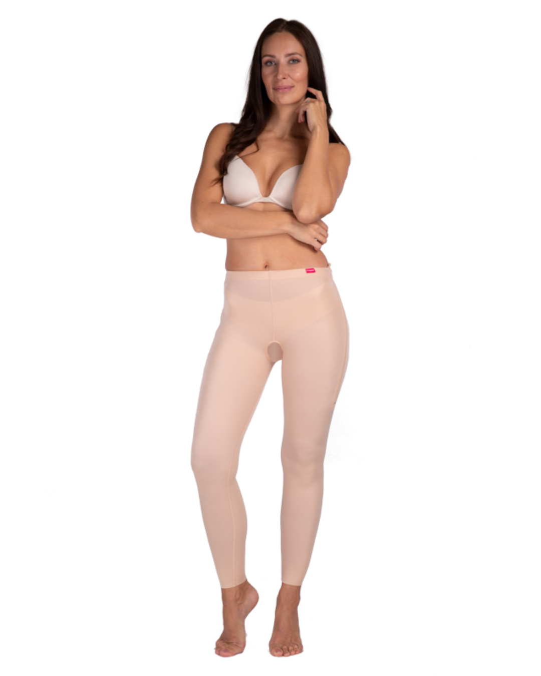 Woman wearing Lipoelastic TB Comfort leggings post-surgery compression garment designed to support recovery after liposuction or body contouring procedures.