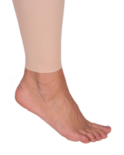 Ankle shot of woman wearing Lipoelastic TB Comfort leggings post-surgery compression garment designed to support recovery after liposuction or body contouring procedures.
