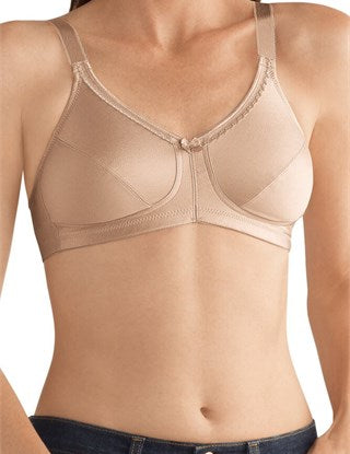 Amoena Rita Non-Wired Bra in Sand: A supportive, wire-free bra featuring two-section cups for enhanced support, adjustable straps, and bilateral COOLMAX® pockets to securely hold breast forms or shapers. Designed with a soft lace-trimmed neckline and moisture-wicking fabric for all-day comfort