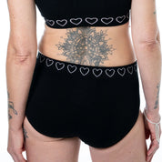 woman wearing the black cancer research brief image showing the back of the knicker