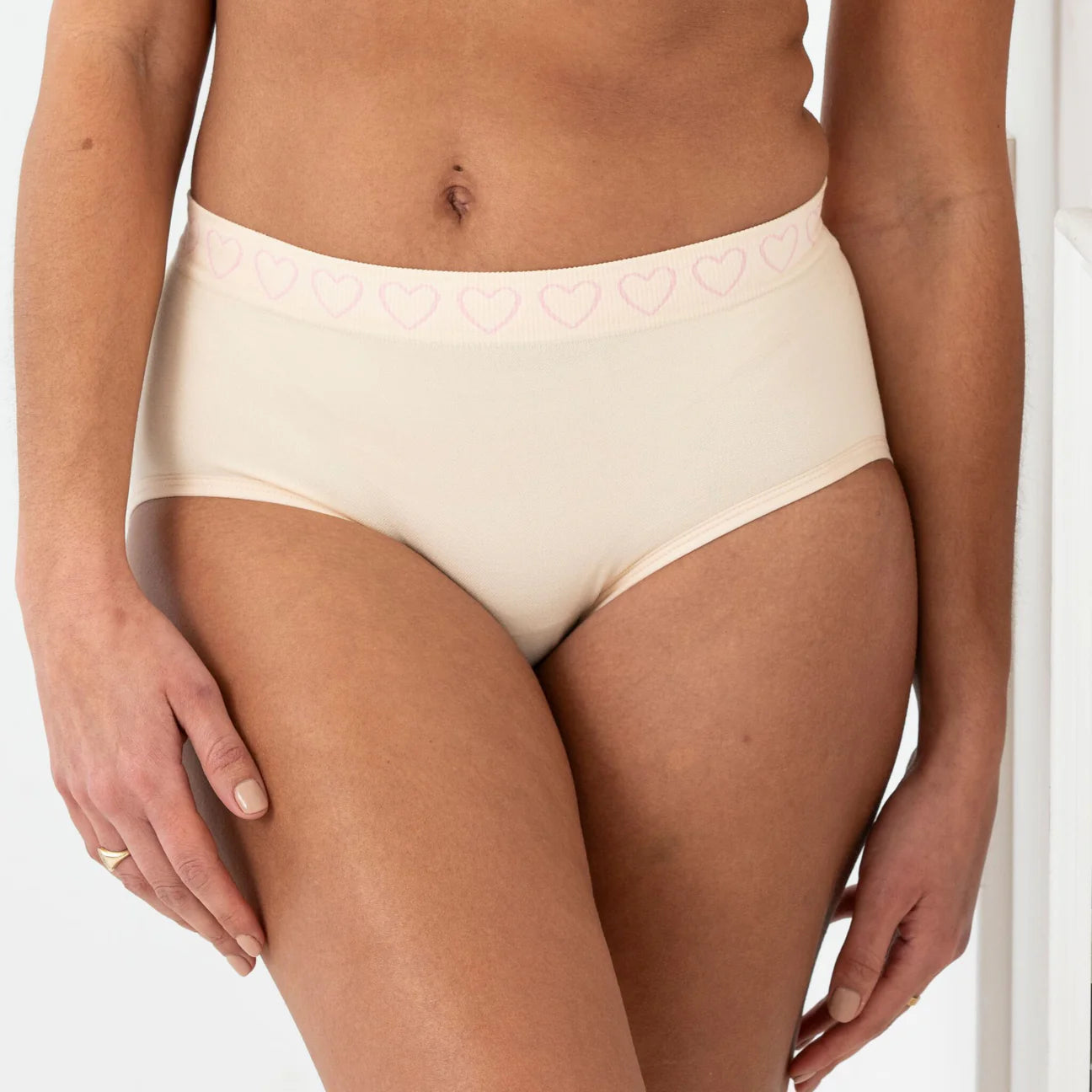 woman wearing blush cancer research uk brief 