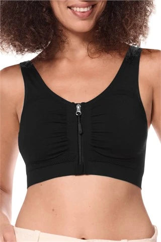 Amoena post surgery bra, Emilia,  an adjustable strap bra with bilateral pockets for prosthesis, front zip closure, and integrated mesh panels. It is suitable for breast surgeries like reconstruction, reduction, augmentation, and mastectomy. The garment also features a hook and loop fastener flap for compression belt attachment. Experience gentle support with the Amoena Emilia post surgery bra 