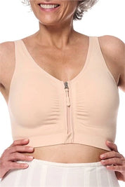 Amoena post surgery bra, Emilia,  an adjustable strap bra with bilateral pockets for prosthesis, front zip closure, and integrated mesh panels. It is suitable for breast surgeries like reconstruction, reduction, augmentation, and mastectomy. The garment also features a hook and loop fastener flap for compression belt attachment. Experience gentle support with the Amoena Emilia post surgery bra 