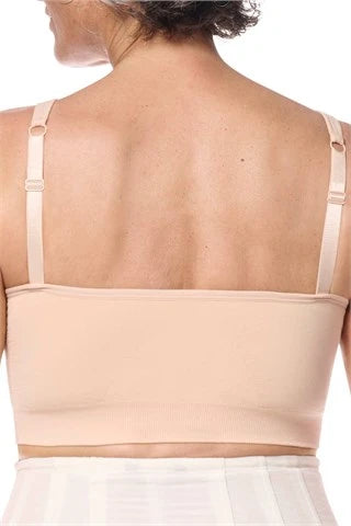 Amoena post surgery bra, Emilia,  an adjustable strap bra with bilateral pockets for prosthesis, front zip closure, and integrated mesh panels. It is suitable for breast surgeries like reconstruction, reduction, augmentation, and mastectomy. The garment also features a hook and loop fastener flap for compression belt attachment. Experience gentle support with the Amoena Emilia post surgery bra 