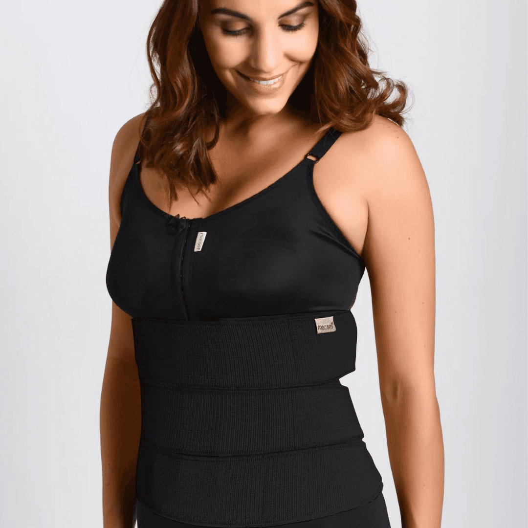 Image of a macom black post-operative 3 Panel Binder for abdominal compression. This abdominal binder is elasticated with velcro fastening provides flexible and adjustable compression. Ideal for post-abdominal surgery recovery including, hernia surgery, bariatric surgery, and as a back support. Enhance your recovery with this comfortable and supportive compression garment
