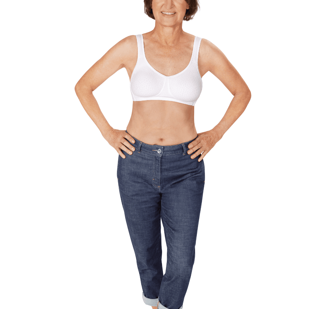 The Amoena Mona Bra is a popular choice with seamless, non-wired cups and bi-lateral pockets. Made with Meryl Microfibre for superior comfort and support. The straps are lightly padded and designed to be wider across the shoulders, reducing tension on the neck and shoulders. This bra is suitable for post-surgery wear and comes in white, black, and champagne colors. If your size is not available, please contact us for assistance. Discover the exceptional fit and comfort of the Amoena Mona Bra